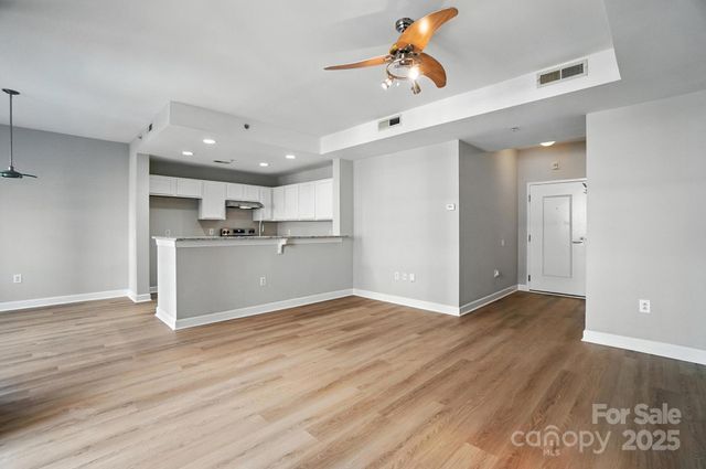 a view of kitchen with wooden floor and window