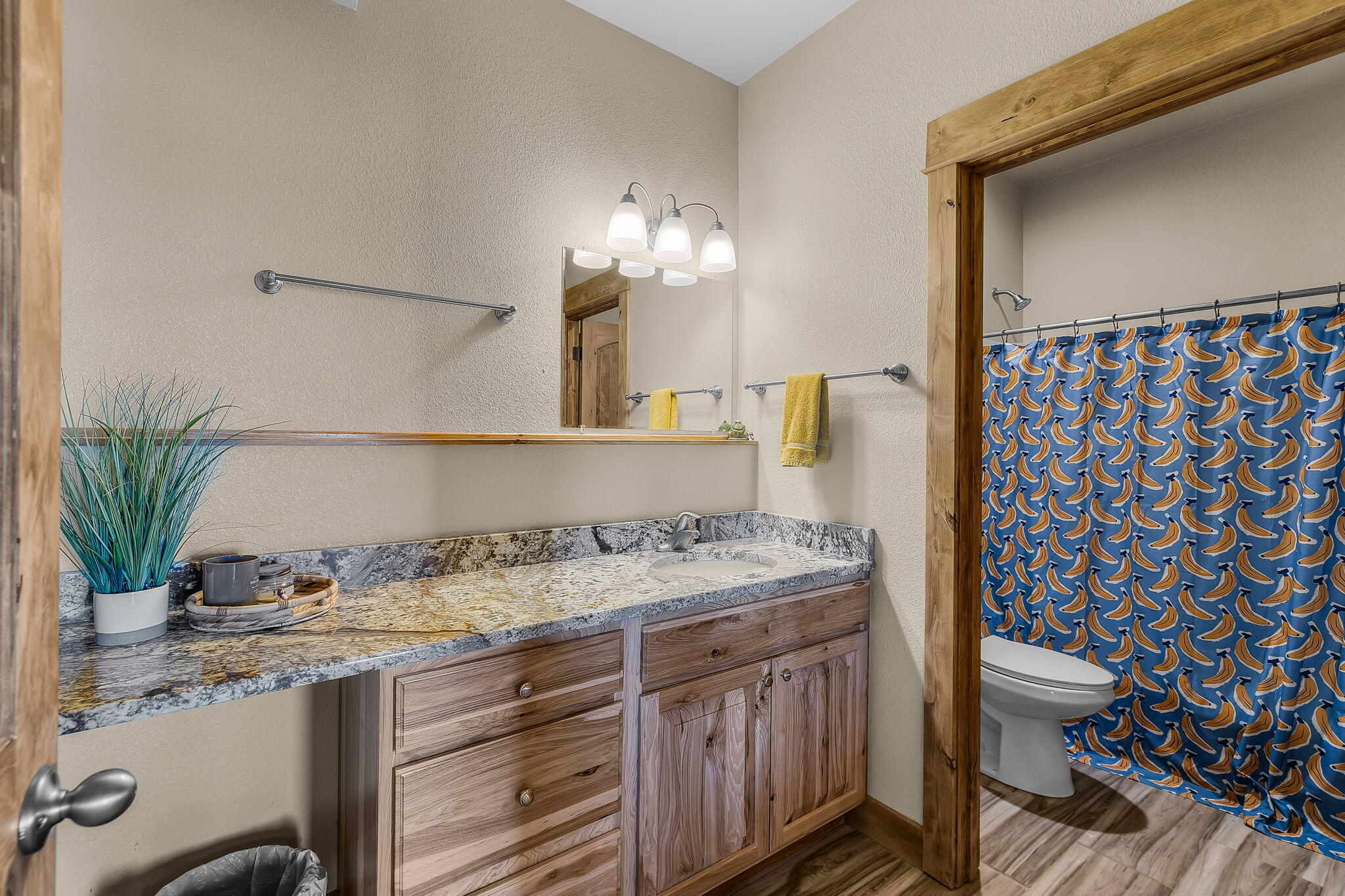 6040 Gravett Road Prineville, OR 97754 - Photo 30 of 77 a bathroom with a granite countertop sink a toilet and shower