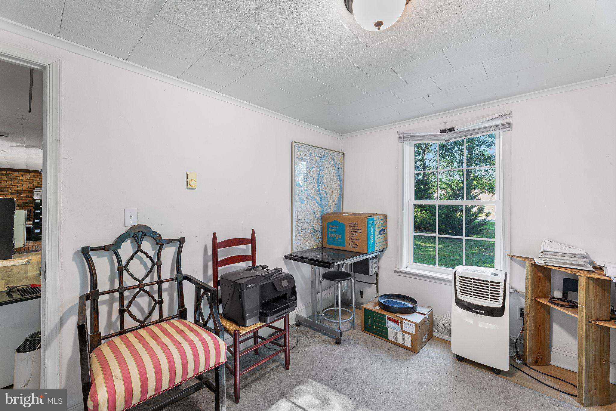 11920 Back Creek Road Bishopville, MD 21813 - Photo 24 of 38 a view of a workspace with furniture and a window