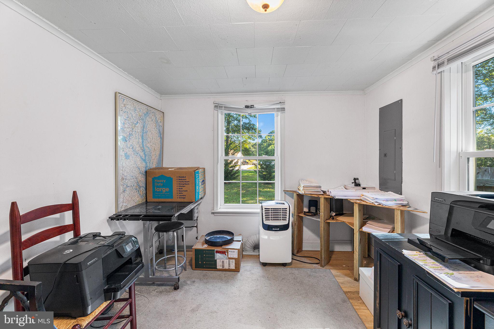 11920 Back Creek Road Bishopville, MD 21813 - Photo 25 of 38 a view of a workspace with furniture and a window