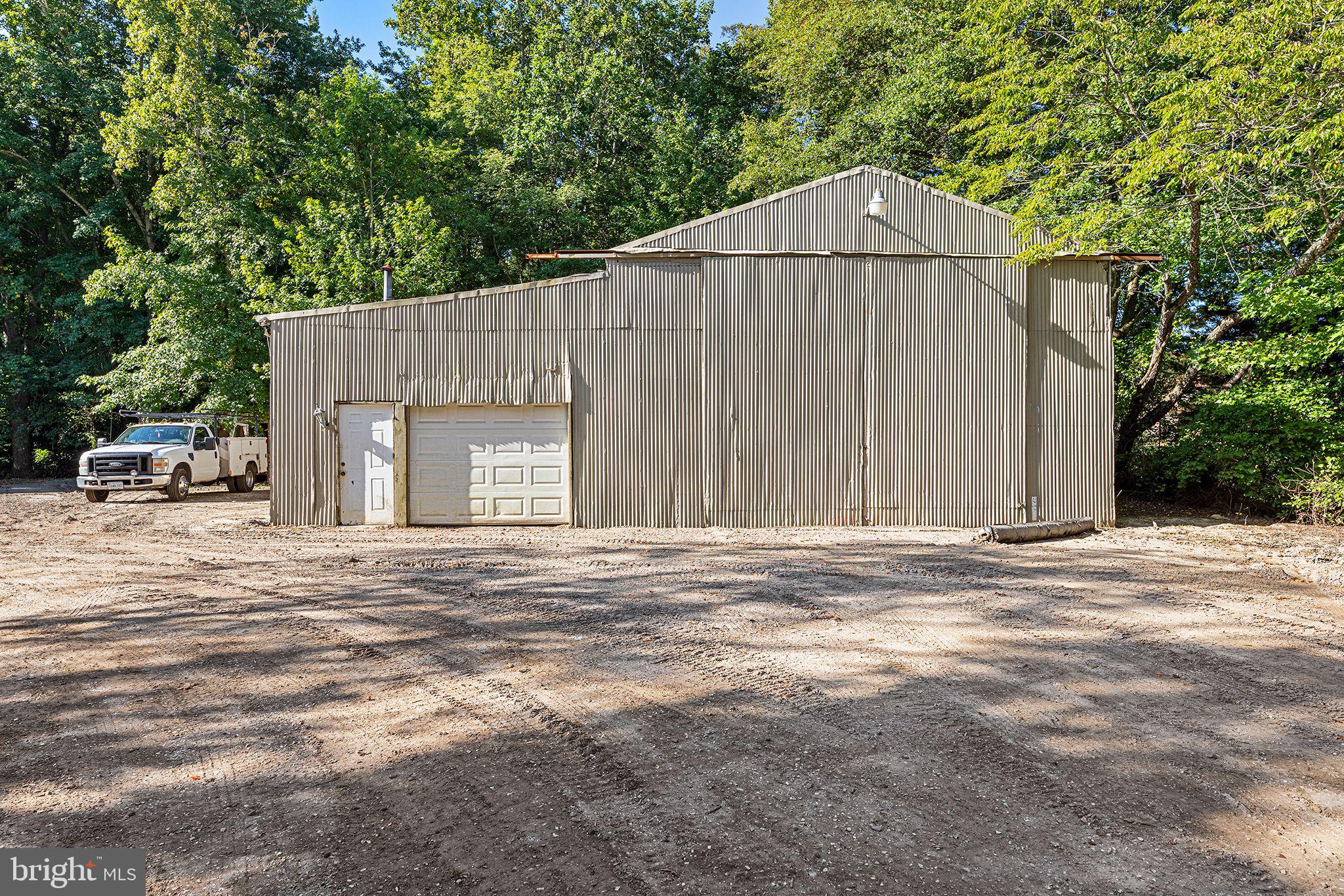 11920 Back Creek Road Bishopville, MD 21813 - Photo 31 of 38 a view of a house with backyard and trees