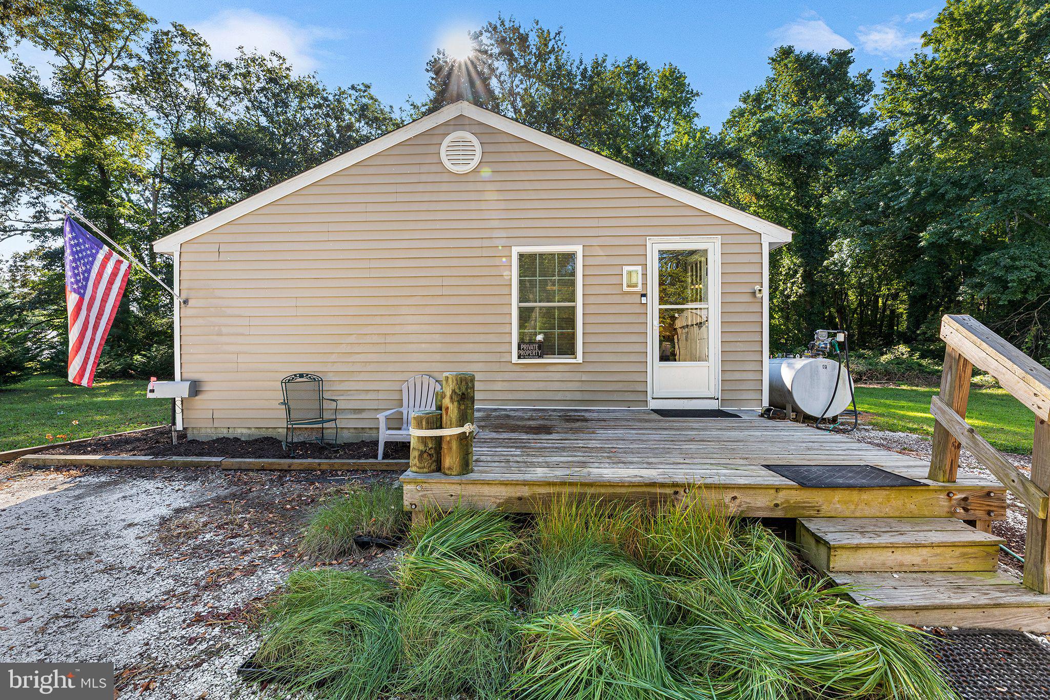 11920 Back Creek Road Bishopville, MD 21813 - Photo 9 of 38 a backyard of a house with barbeque oven