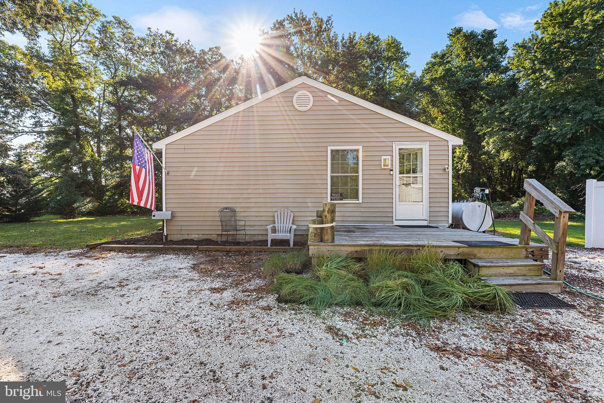 11920 Back Creek Road Bishopville, MD 21813 - Photo 10 of 38 a front view of a house with a yard