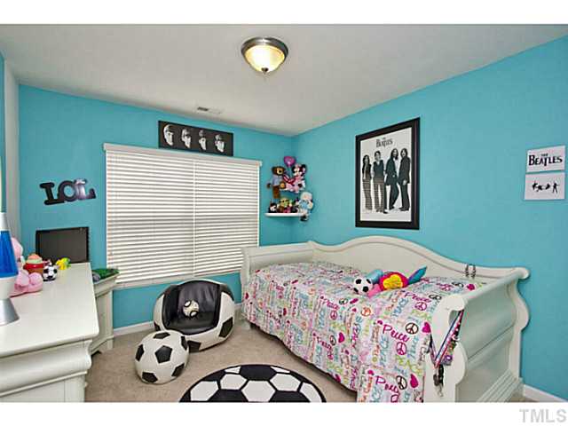 1802 Affirmed Way Cary, NC 27519 - Photo 13 of 24 a bedroom with a bed a baby and a dresser