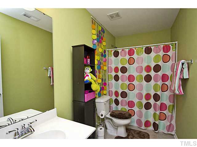 1802 Affirmed Way Cary, NC 27519 - Photo 15 of 24 a bathroom with a sink and a mirror
