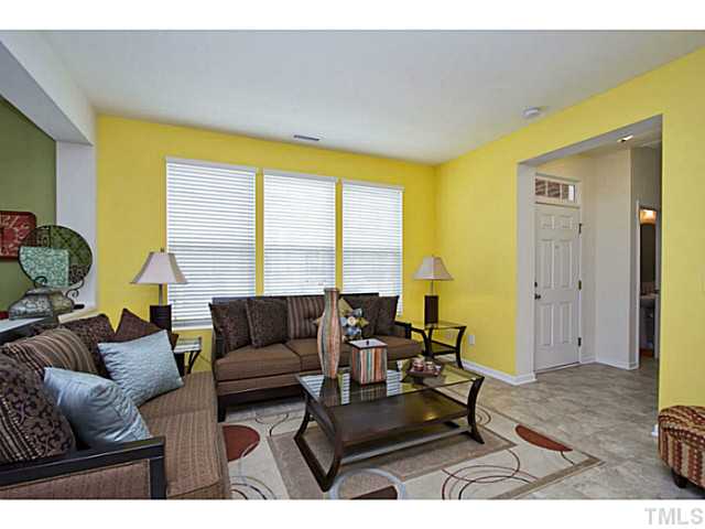 1802 Affirmed Way Cary, NC 27519 - Photo 3 of 24 a living room with furniture and large windows