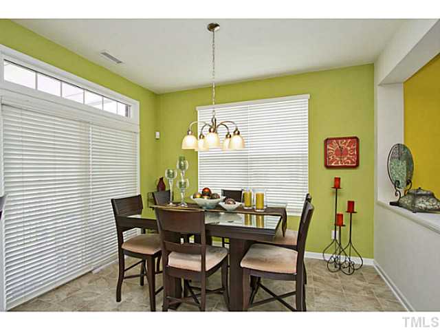 1802 Affirmed Way Cary, NC 27519 - Photo 7 of 24 a view of a dining room with furniture and a window