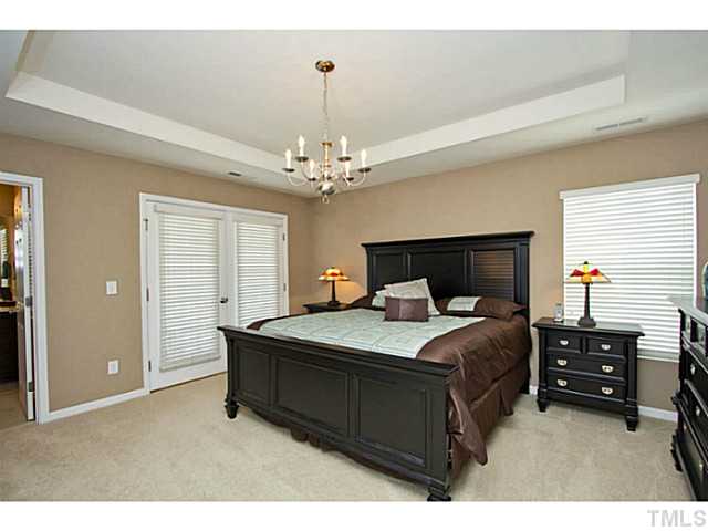 1802 Affirmed Way Cary, NC 27519 - Photo 9 of 24 a bedroom with bed and window