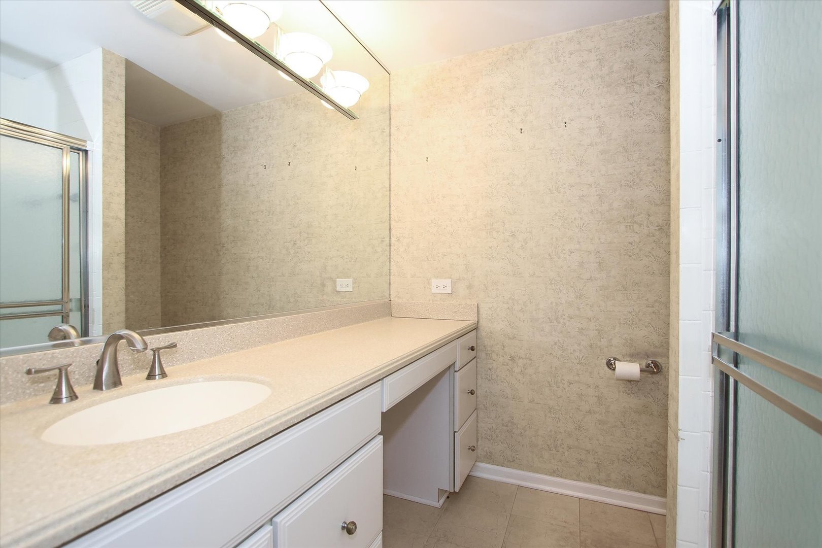 299 Mallard Point, Unit D Lake Barrington, IL 60010 - Photo 12 of 30 a bathroom with a granite countertop sink and a mirror