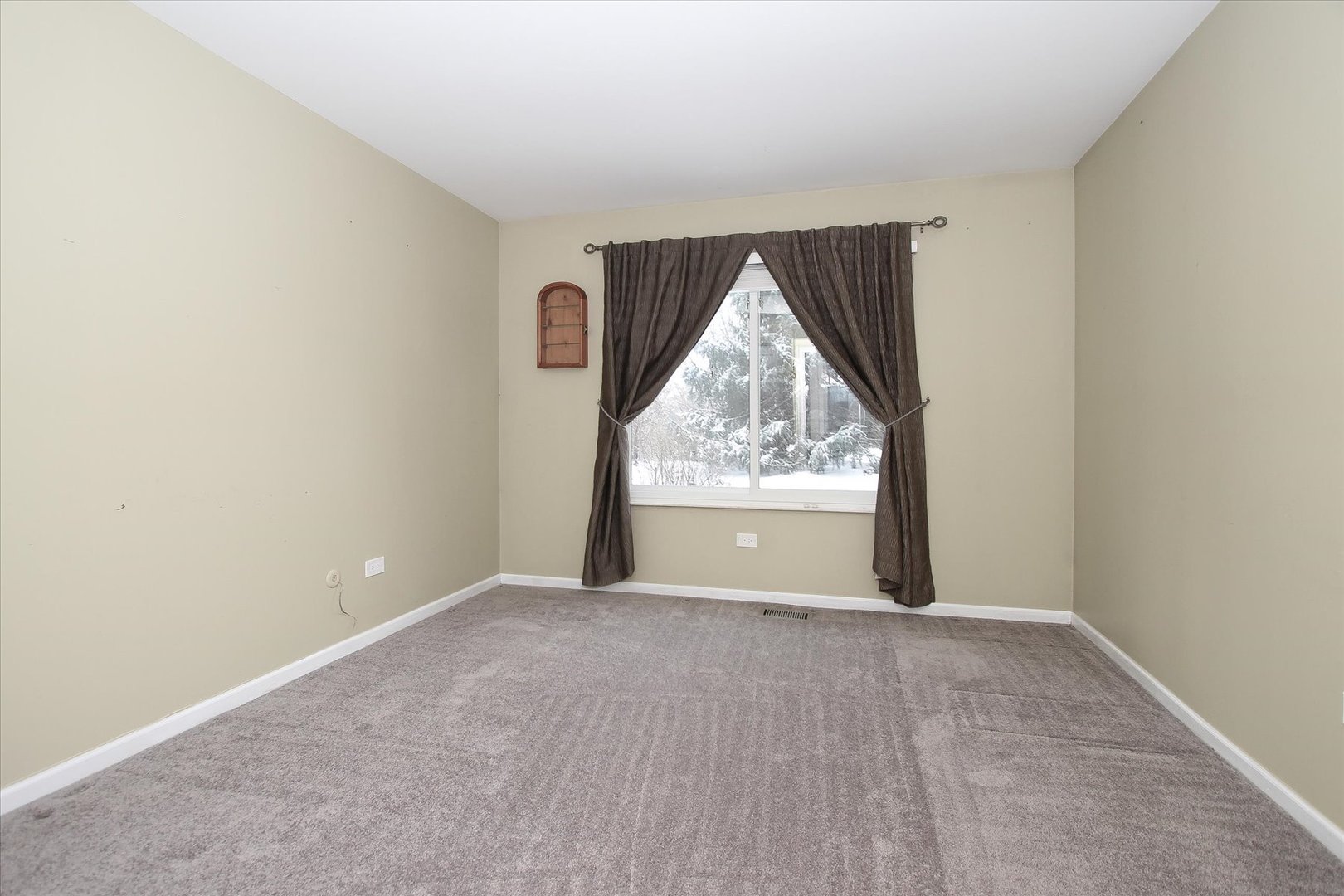 299 Mallard Point, Unit D Lake Barrington, IL 60010 - Photo 13 of 30 a view of an empty room with a window