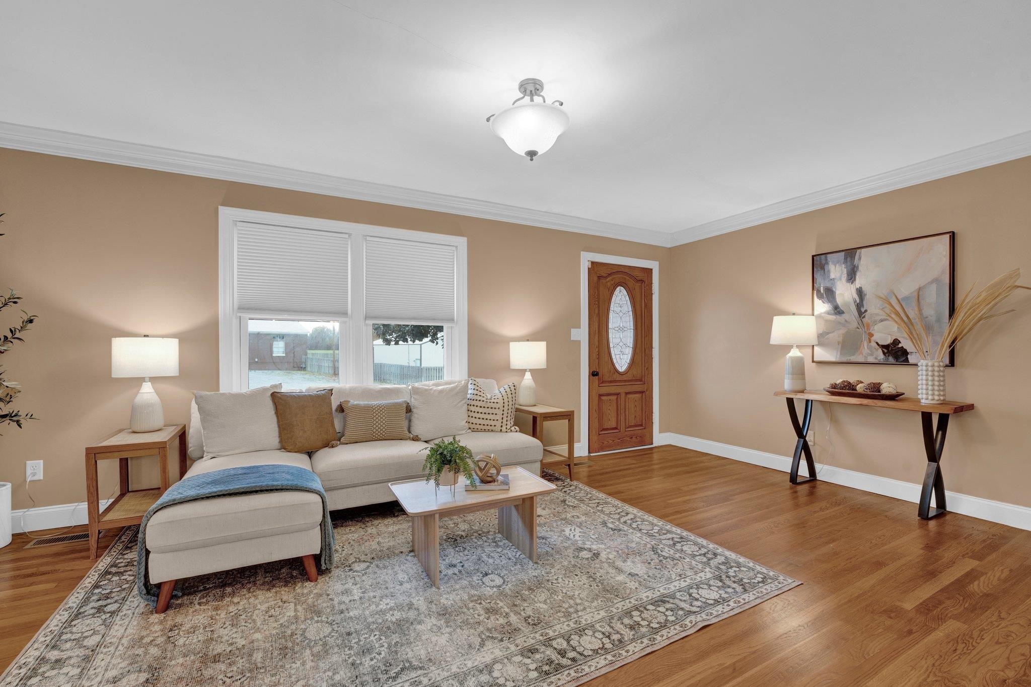 1060 Beaver Creek Road Brighton, TN 38011 - Photo 3 of 40 Living room with wood-type flooring and ornamental molding