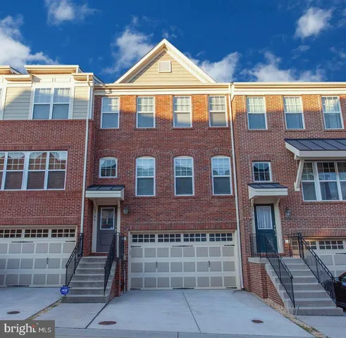 a front view of a house with glass windows