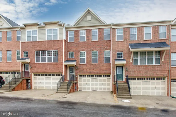 a front view of a building with a road