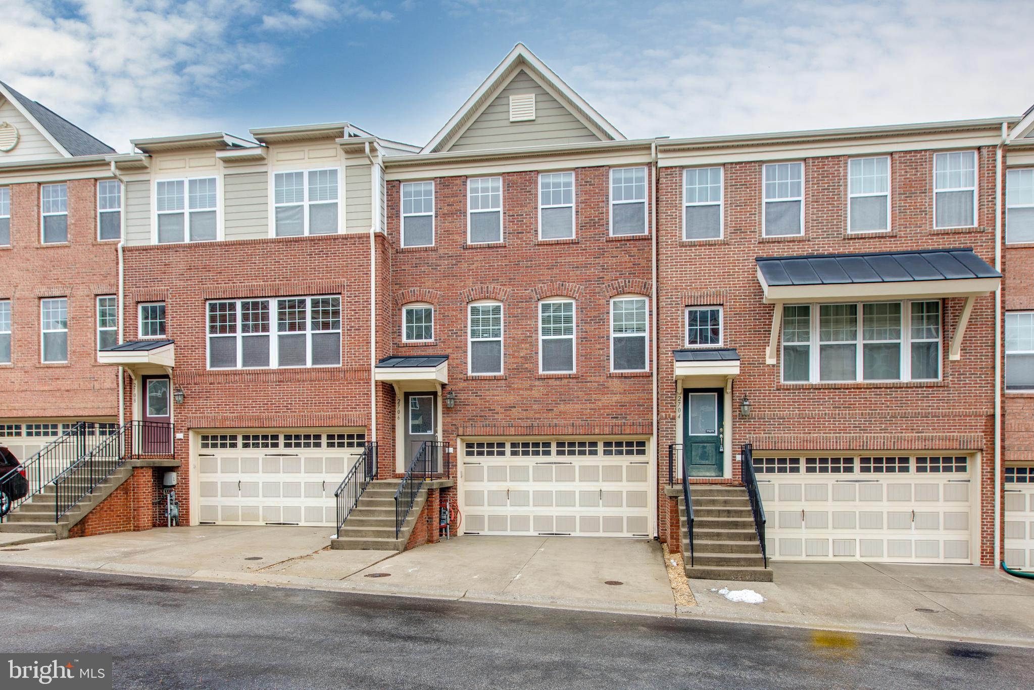 2706 Amber Crest Road Hanover, MD 21076 - Photo 2 of 44 a front view of a building with a road