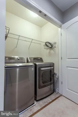 a utility room with washer and dryer