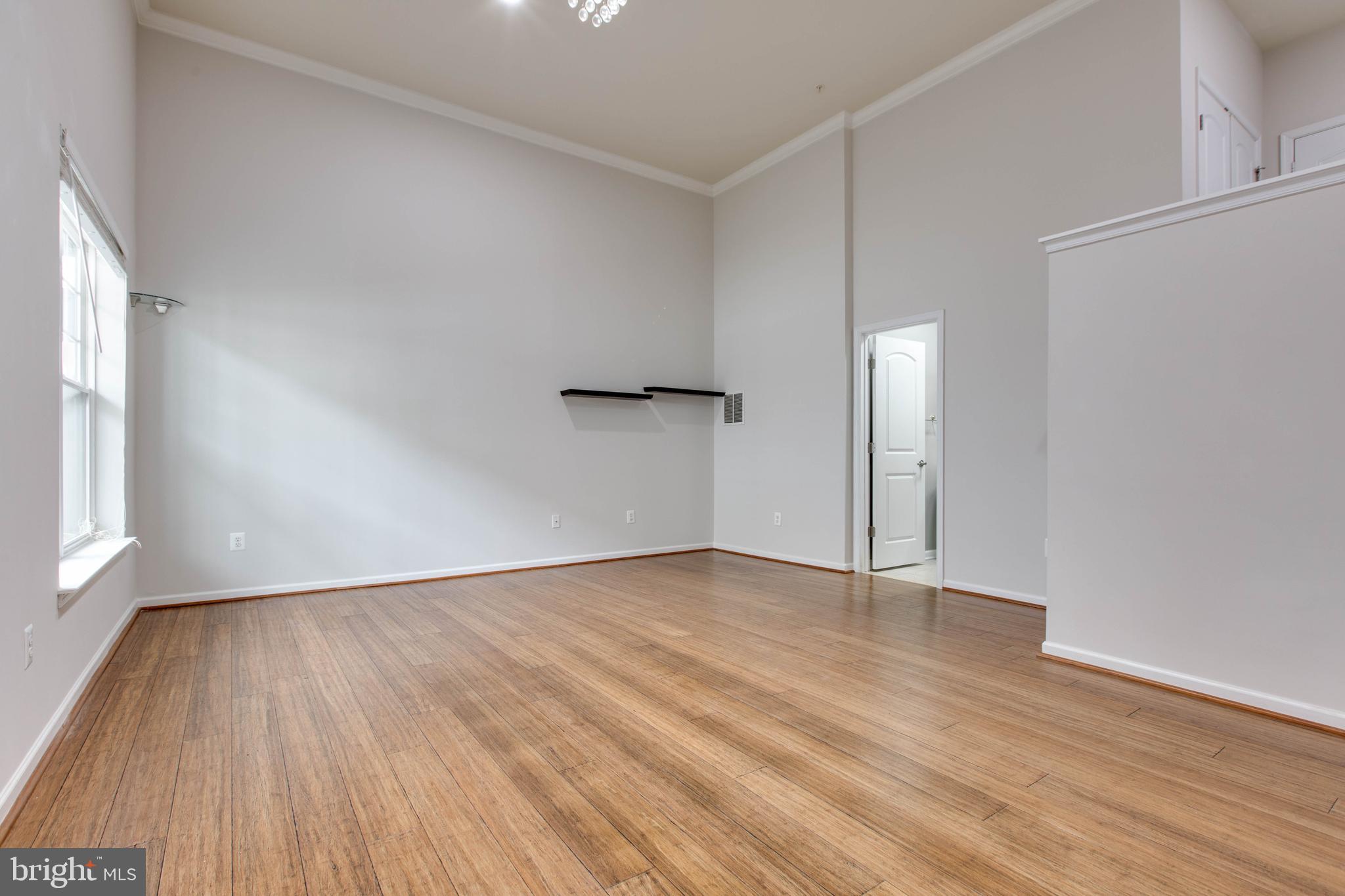 2706 Amber Crest Road Hanover, MD 21076 - Photo 37 of 44 an empty room with wooden floor and windows