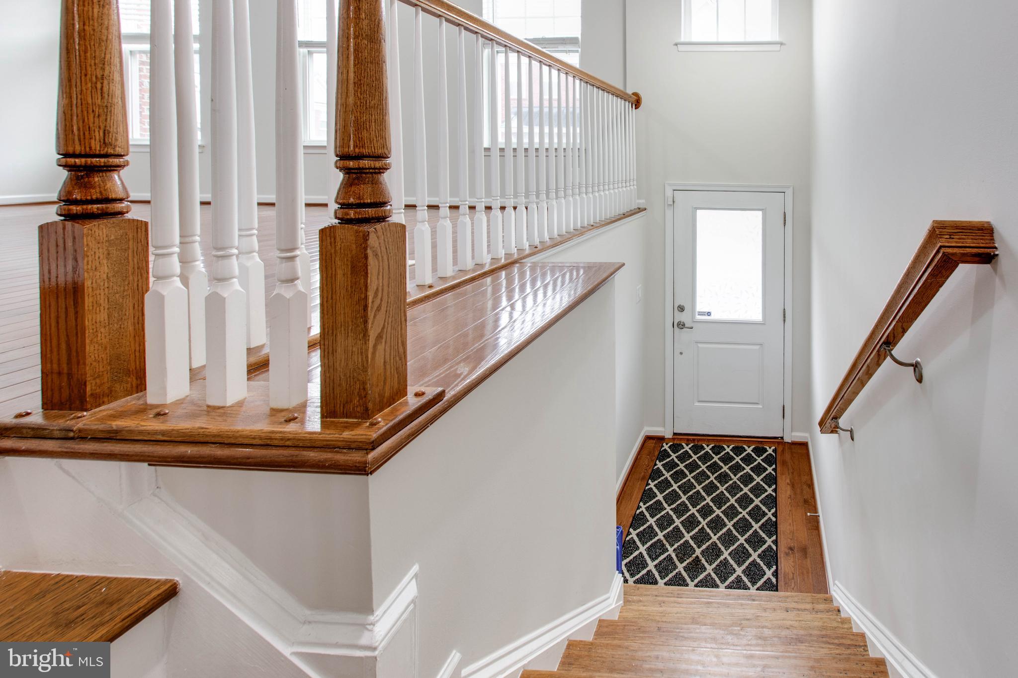 2706 Amber Crest Road Hanover, MD 21076 - Photo 4 of 44 a view of staircase with wooden floor and a rug