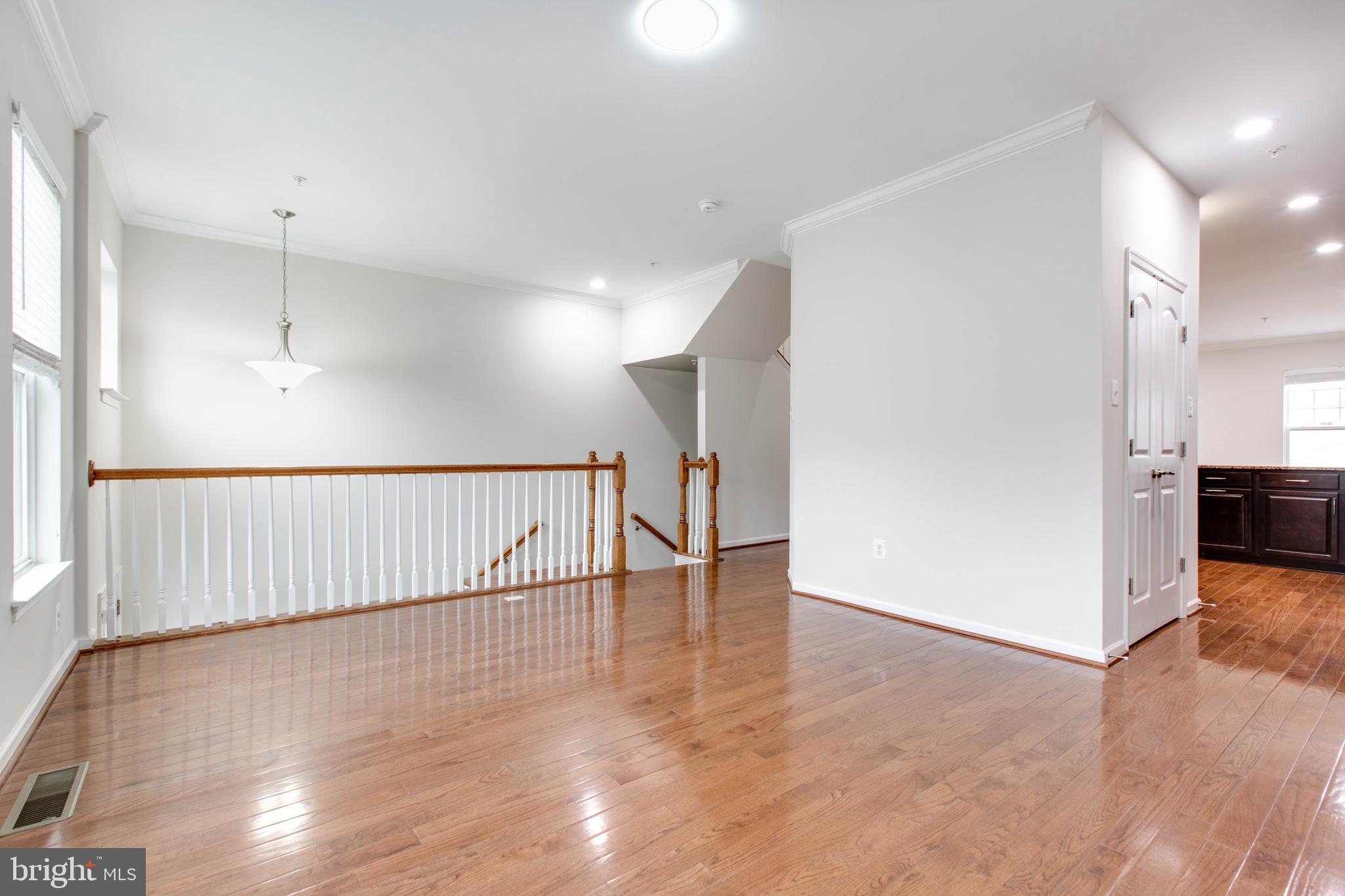 2706 Amber Crest Road Hanover, MD 21076 - Photo 7 of 44 a view of a hallway with wooden floor