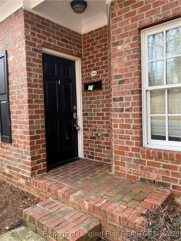 a view of front door of a house with an empty space