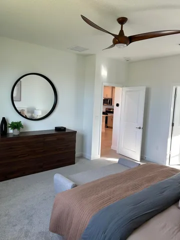 a bed room with a bed and a chandelier