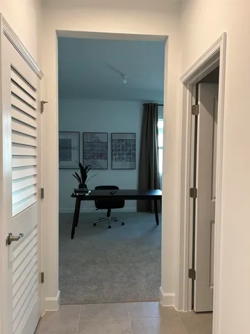 a living room with furniture and a gate