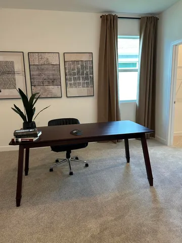 a workspace with furniture and window