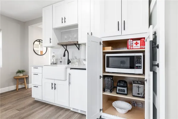 a kitchen with stainless steel appliances a stove a microwave and cabinets