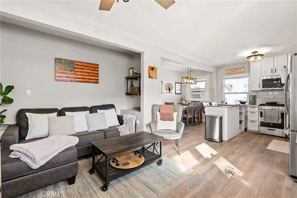 a dining room with furniture and window