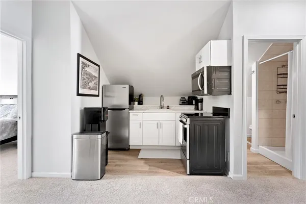 a bedroom with a bed and a walk in closet