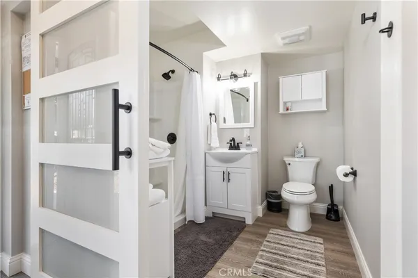 a bathroom with a toilet and a shower