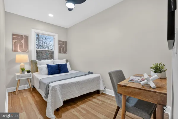 a bedroom with a bed and a table in it