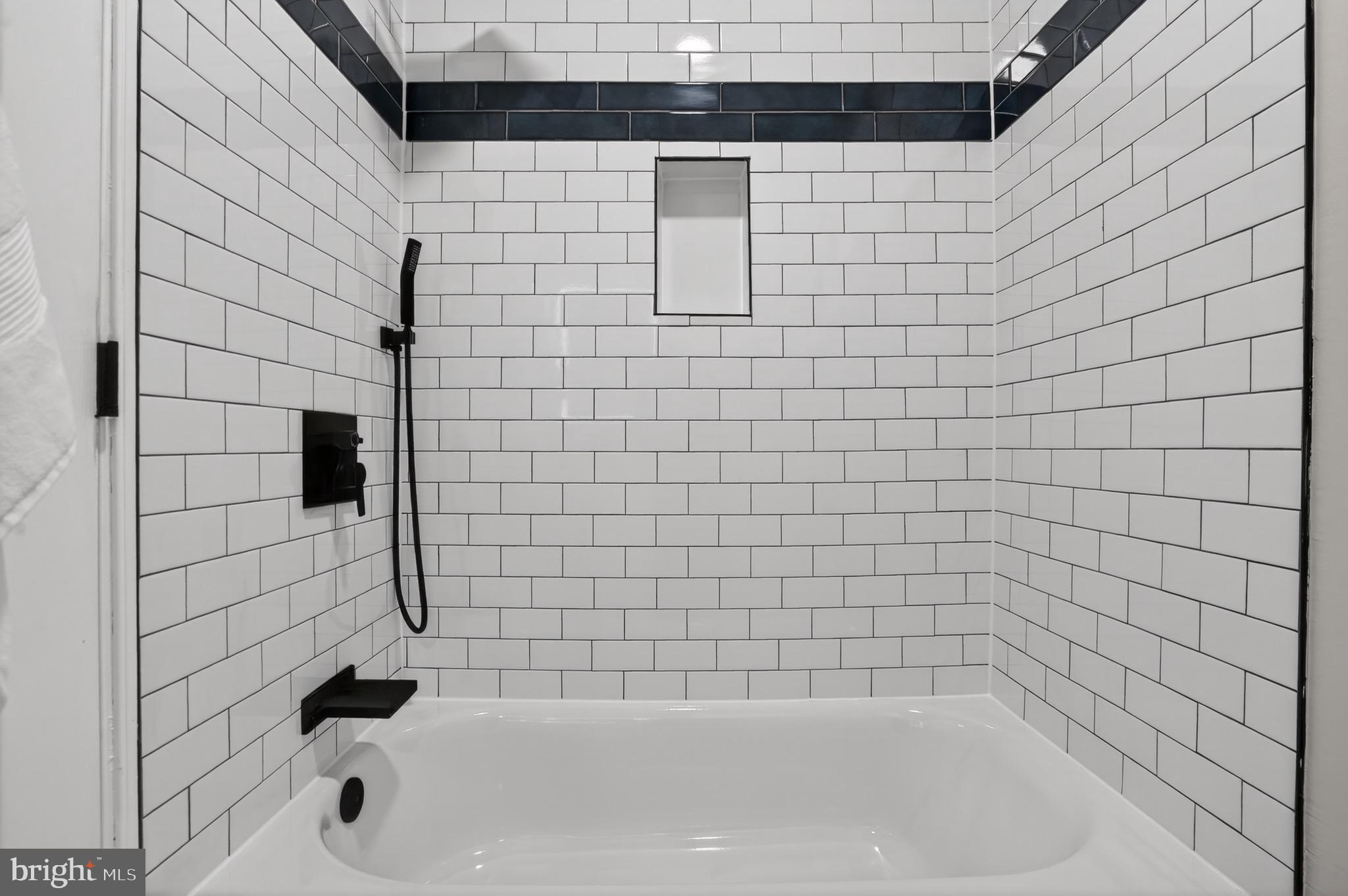 212 36th Street Northeast, Unit 3 Washington, DC 20019 - Photo 14 of 15 a bathroom with a bathtub