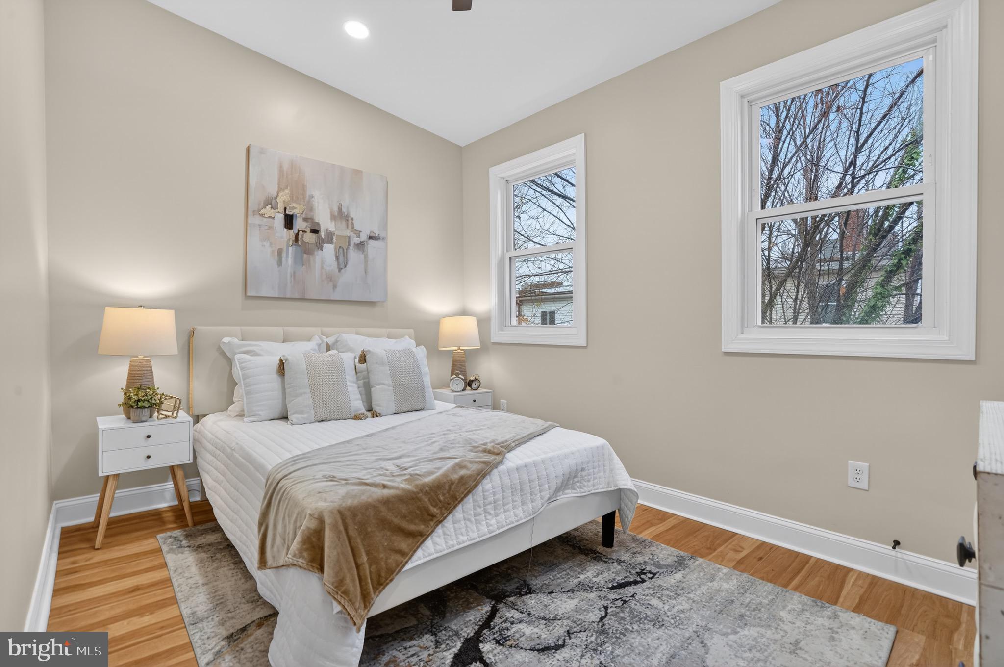 212 36th Street Northeast, Unit 3 Washington, DC 20019 - Photo 3 of 15 a bedroom with a bed and a window