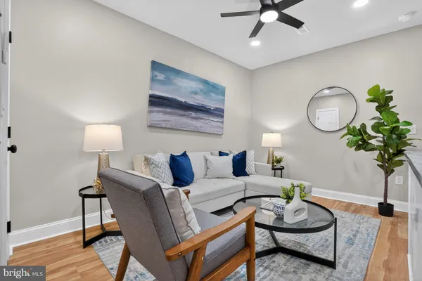 a living room with furniture and a lamp