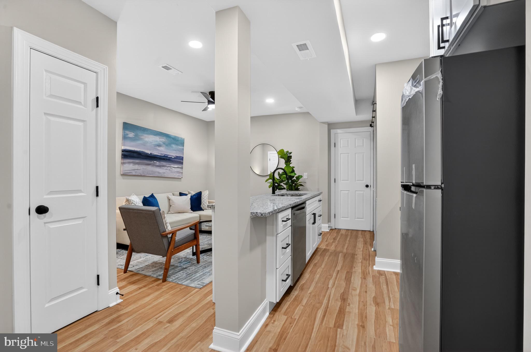 212 36th Street Northeast, Unit 3 Washington, DC 20019 - Photo 7 of 15 a view of a hallway to a livingroom and a dinning room