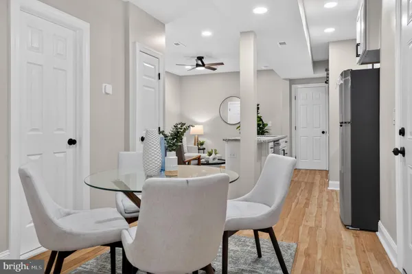 a view of a dining room with furniture and wooden floor