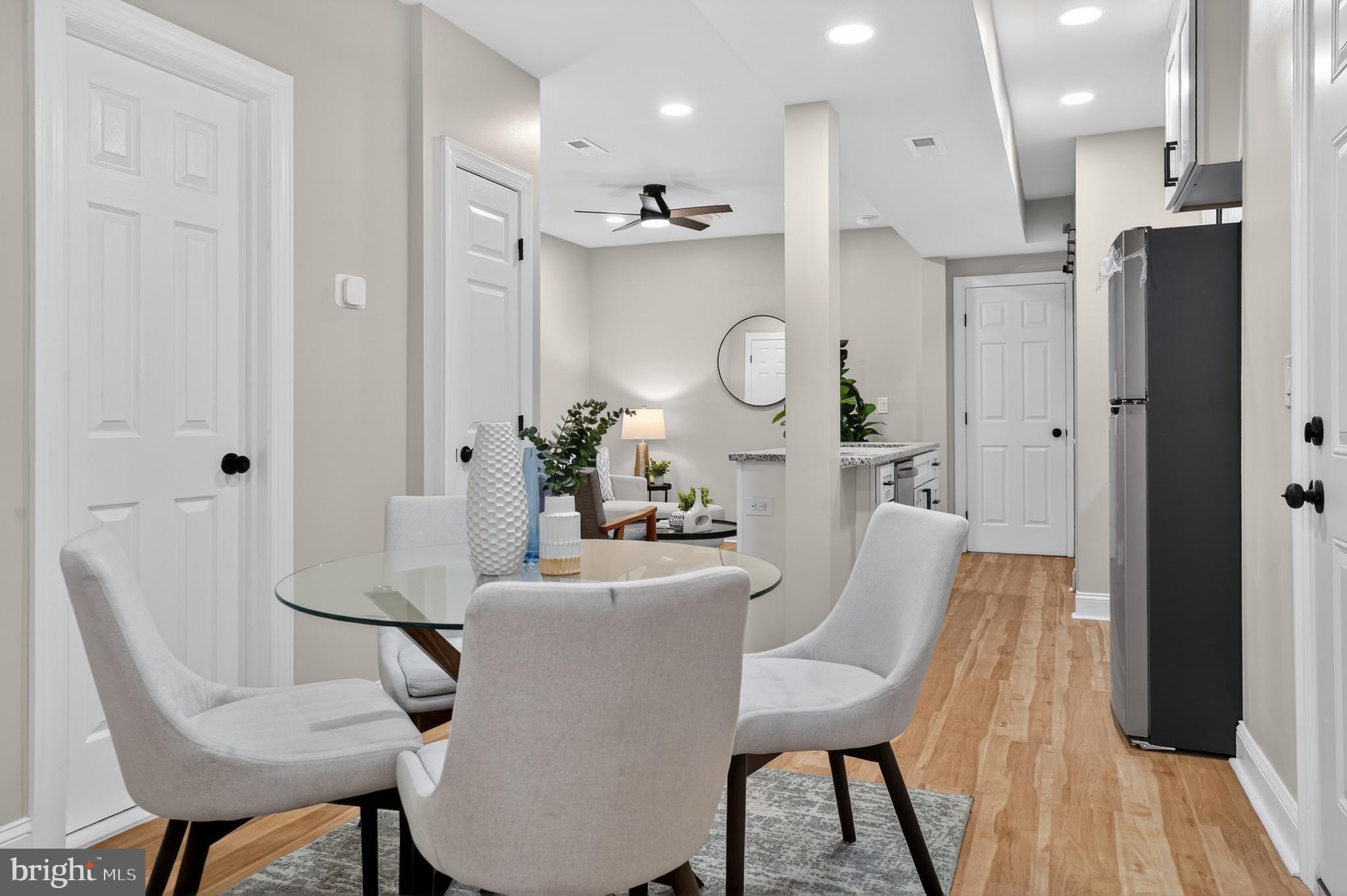 212 36th Street Northeast, Unit 3 Washington, DC 20019 - Photo 8 of 15 a view of a dining room with furniture and wooden floor