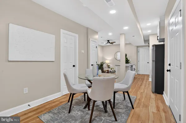 a view of a dining room with furniture and wooden floor