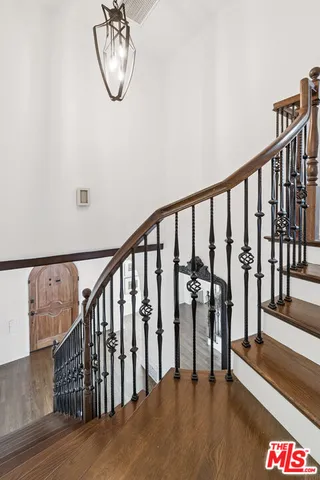 a view of staircase with lots of wooden floor