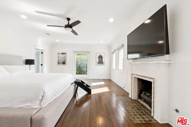 a living room with furniture fireplace and flat screen tv