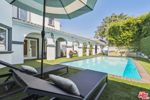 a view of a patio with swimming pool