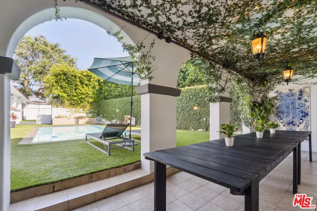 a view of a two chairs in the patio
