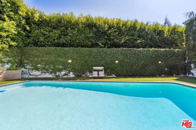 a view of swimming pool with a balcony