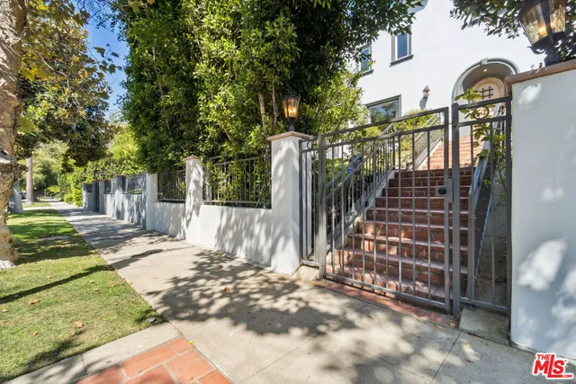 a front view of a house with parking area
