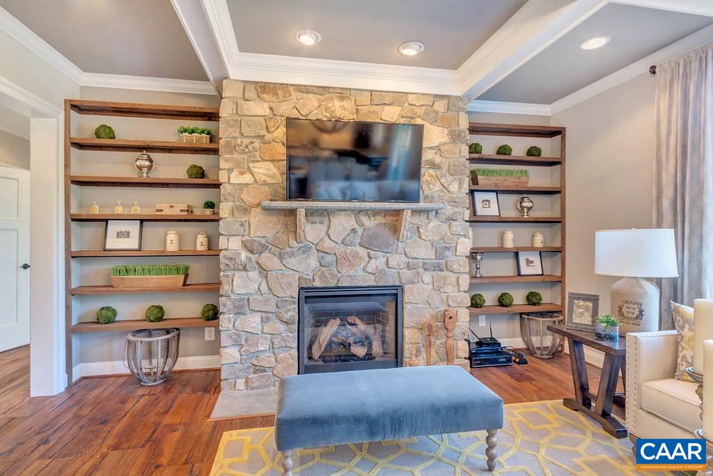 2128 Ridgetop Drive Charlottesville, VA 22903 - Photo 21 of 46 a living room with furniture and a fireplace