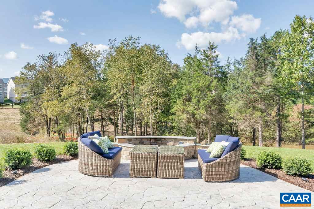 2128 Ridgetop Drive Charlottesville, VA 22903 - Photo 5 of 46 a view of a roof deck with a table and chairs