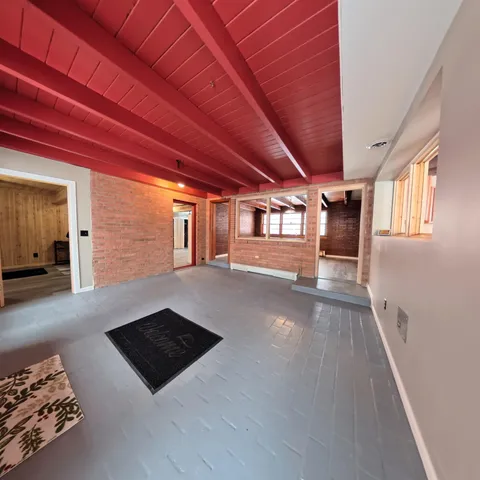 a bathroom with a tub sink and mirror