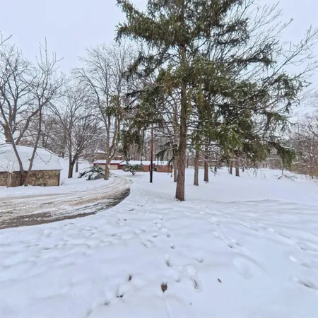 a view of a covered with snow in the yard