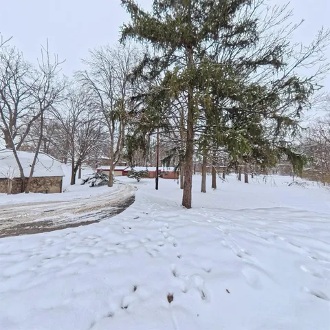 a view of a covered with snow in the yard