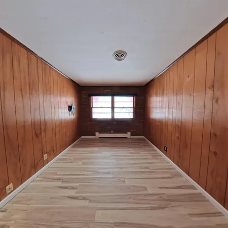 a view of a house with wooden floor
